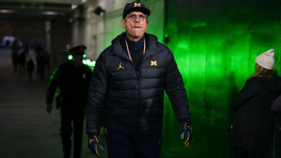Michigan's Jim Harbaugh plans to attend court hearing