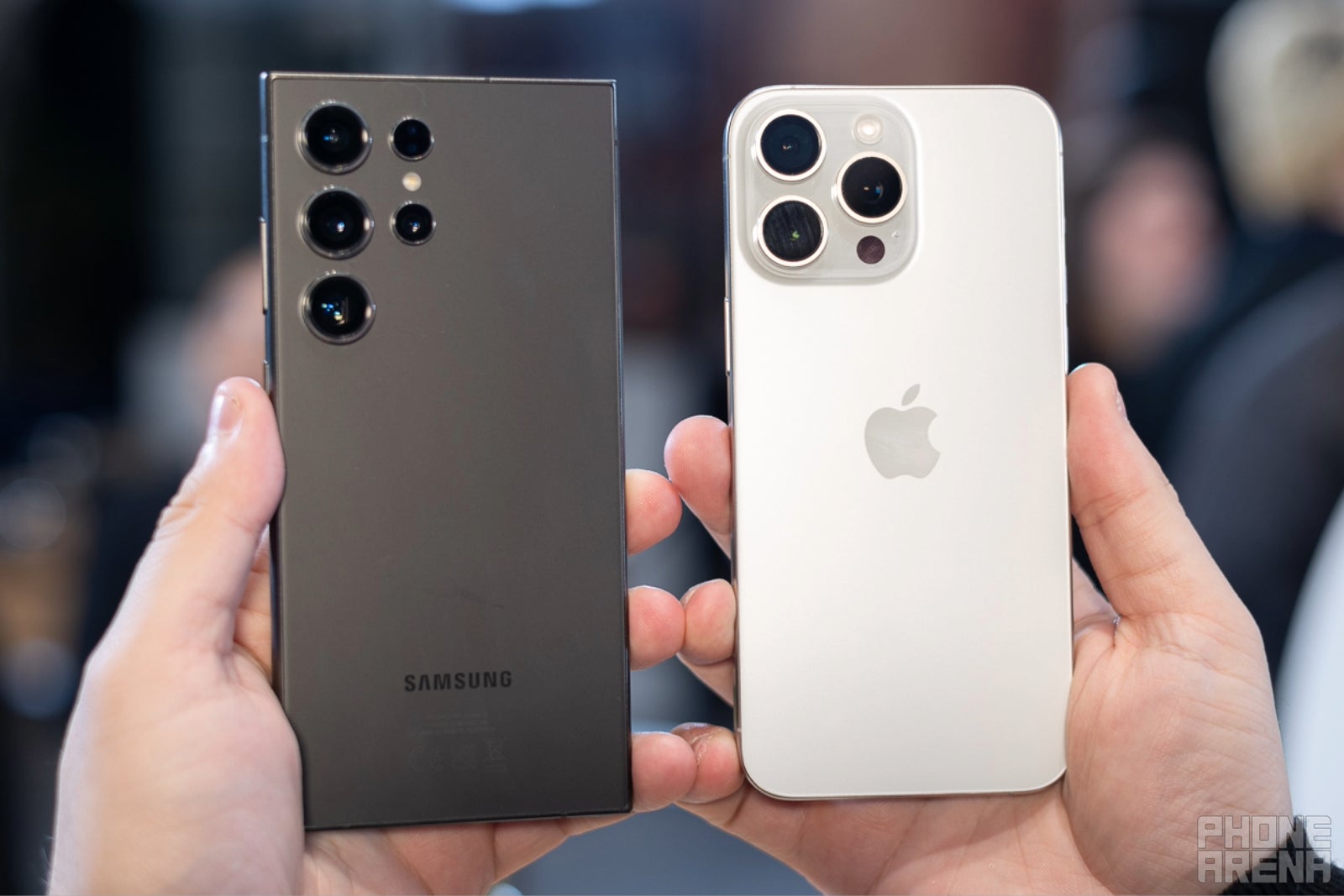 The Galaxy S24 Ultra next to the iPhone 15 Pro Max (Image credit – PhoneArena) – iPhone vs. Galaxy duel is sparked by Rihanna concert, but are phone cameras really that different anyway?